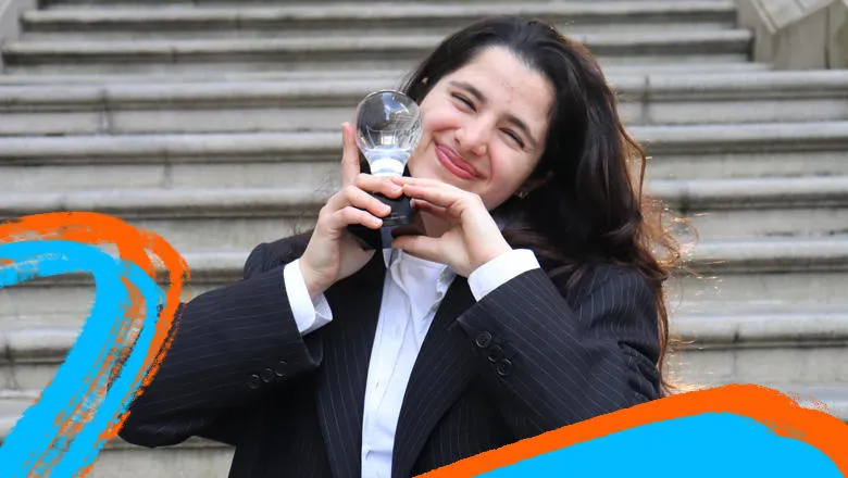 Aya Safieddine, founder of Archif, holding Idea Factory trophy