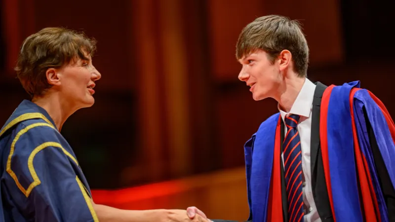 Student receiving award on stage