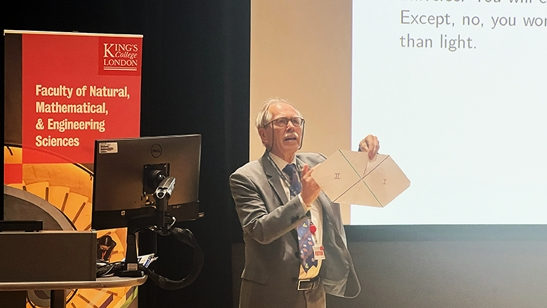 Gerard 't Hooft presenting on stage